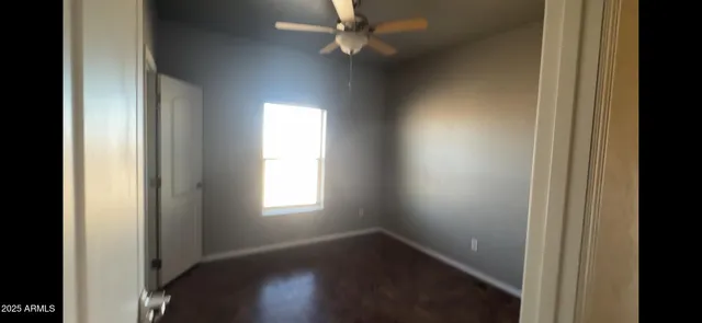 a view of an empty room and a window