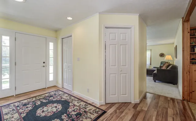 a kitchen with a sink appliances and cabinets