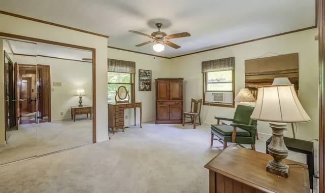 a view of a livingroom with furniture window and wooden floor