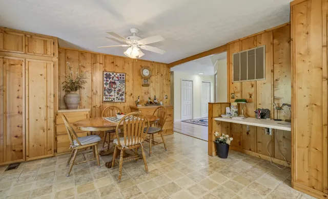 a view of a chair and table in the backyard
