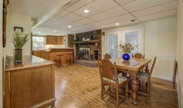 a kitchen with granite countertop wooden cabinets a sink and dishwasher
