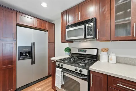 a kitchen with a sink and a stove top oven