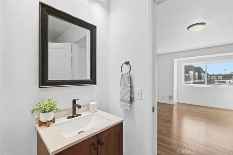 a bathroom with a shower and a glass door