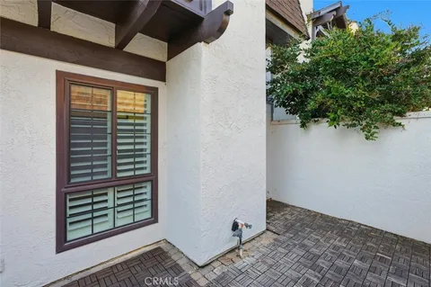 a view of a flower in front of house