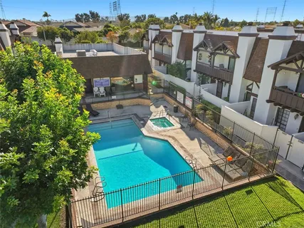 a swimming pool with outdoor seating and yard