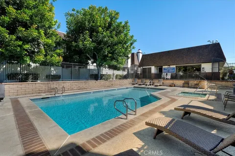 an aerial view of residential houses with city view