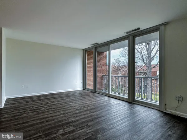 a view of wooden floor and brick walls