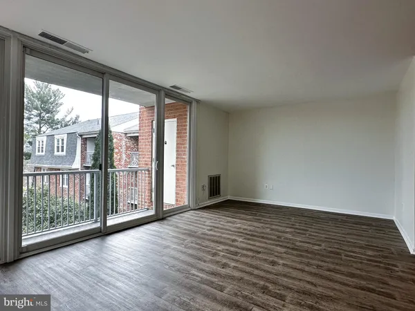 a view of balcony with wooden floor
