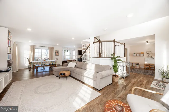 a kitchen with granite countertop wooden cabinets a refrigerator and a sink