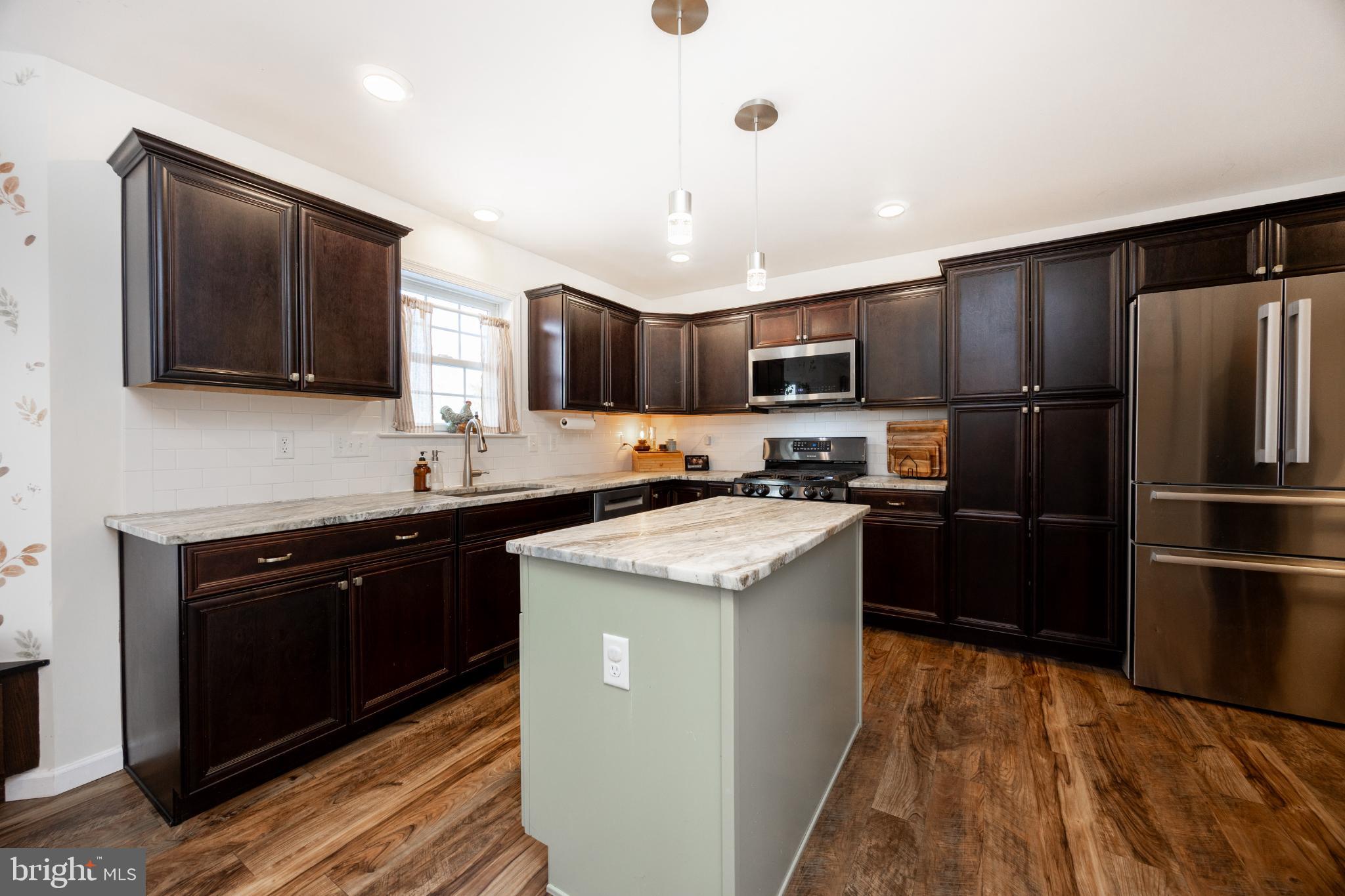 509 Kolb Road Spring City, PA 19475 - Photo 17 of 67 Modern kitchen with elegant dark cabinetry.