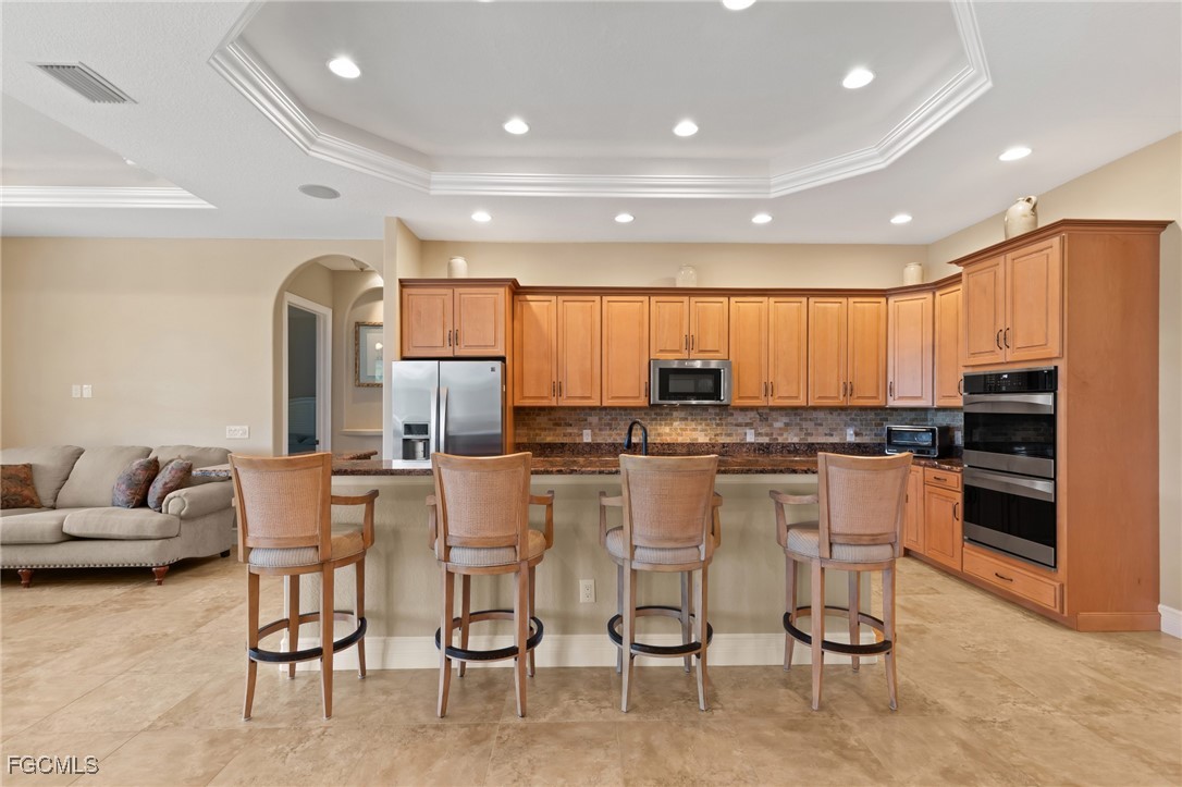 6057 Calusa Rdg Trail Bokeelia, FL 33922 - Photo 7 of 45 a large kitchen with a table and chairs