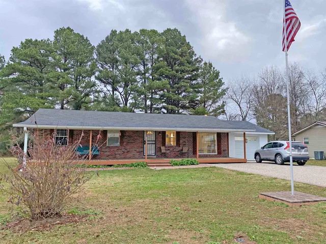 a view of a park with large trees