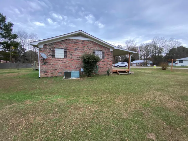 a view of outdoor space with garden and trees
