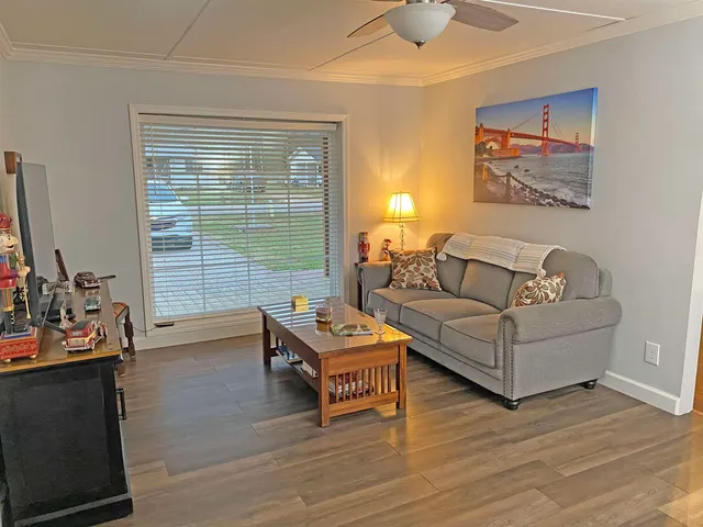 a room with furniture and a wooden floor