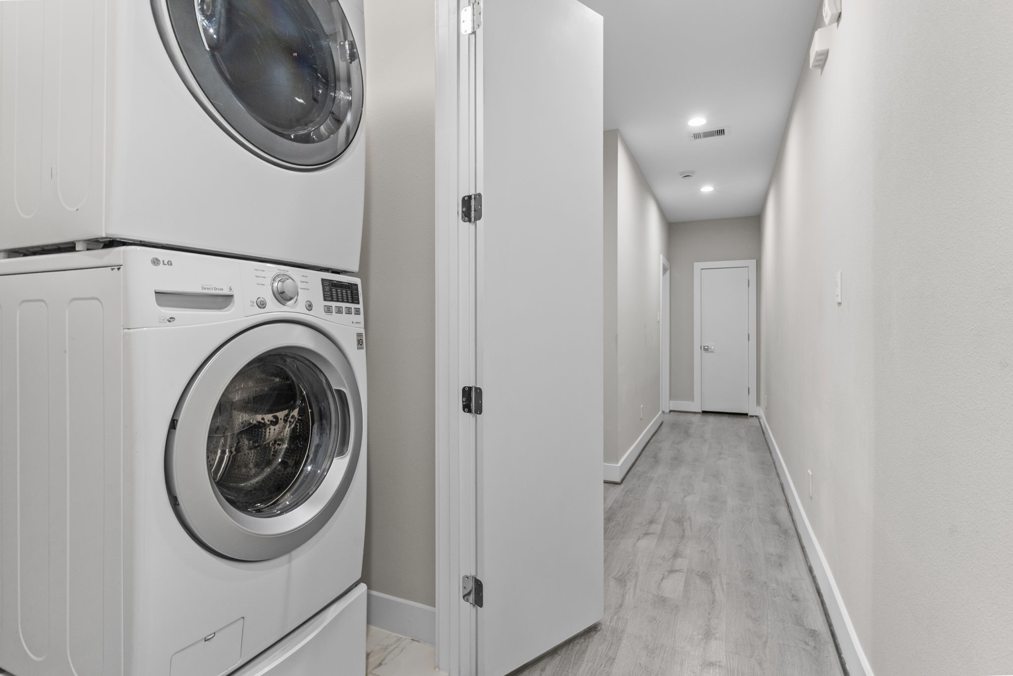 851 Prosper Street Houston, TX 77088 - Photo 32 of 50 a view of a storage & utility room with a washer dryer