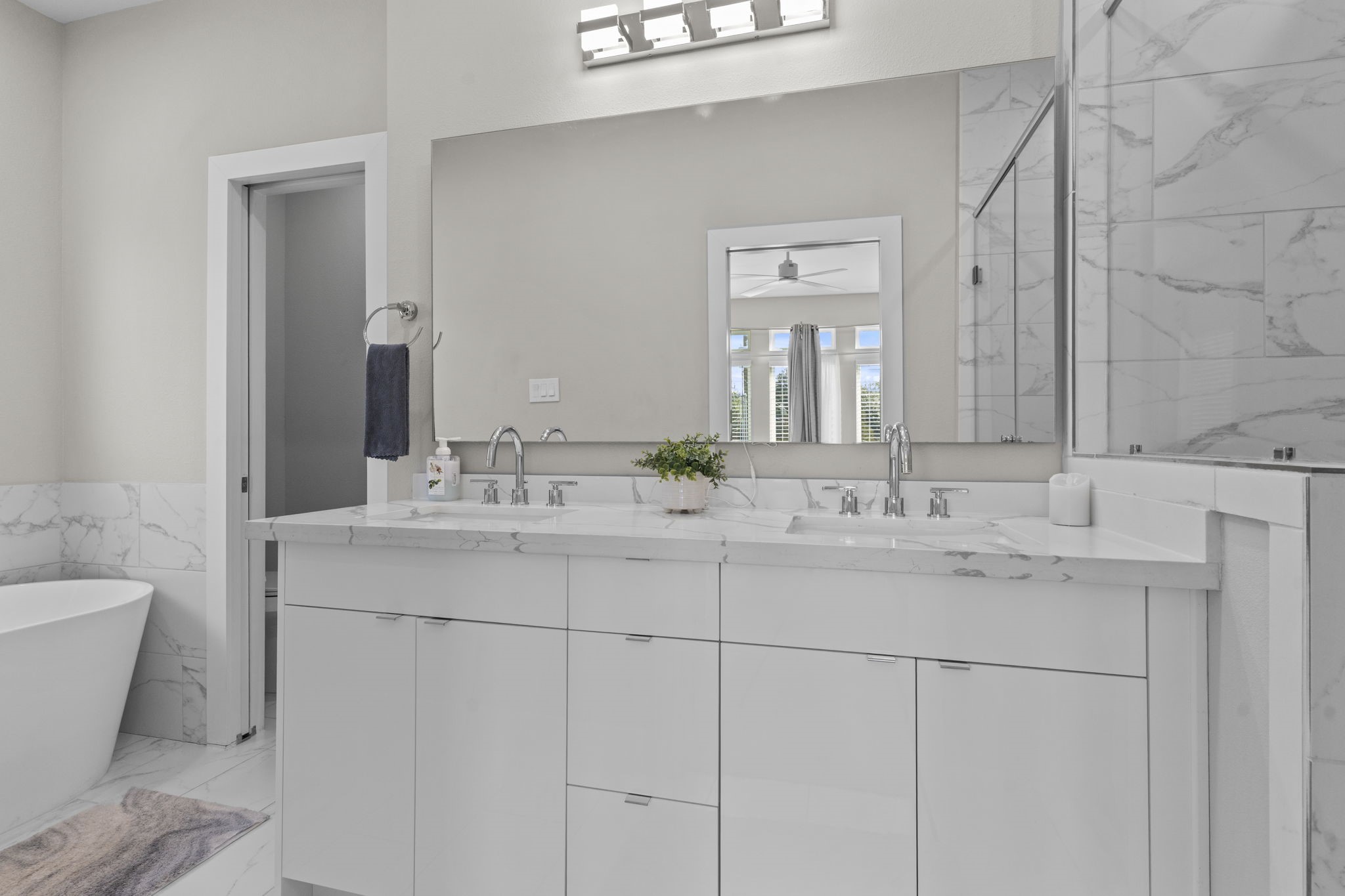 851 Prosper Street Houston, TX 77088 - Photo 39 of 50 a bathroom with a double vanity sink and a mirror