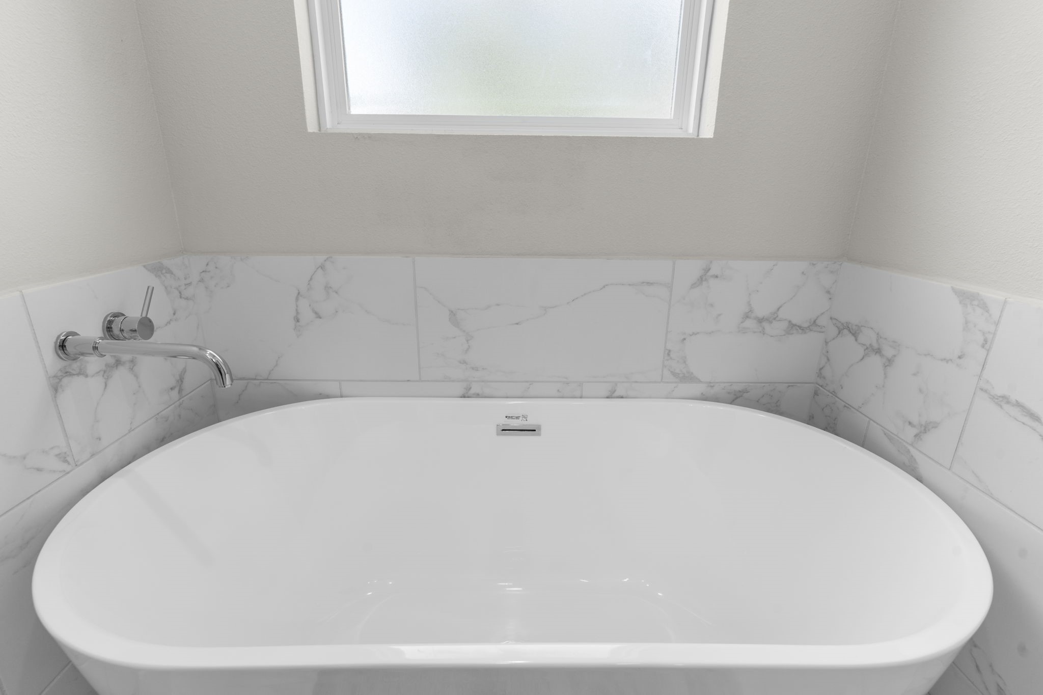 851 Prosper Street Houston, TX 77088 - Photo 40 of 50 a white bath tub sitting in a bathroom