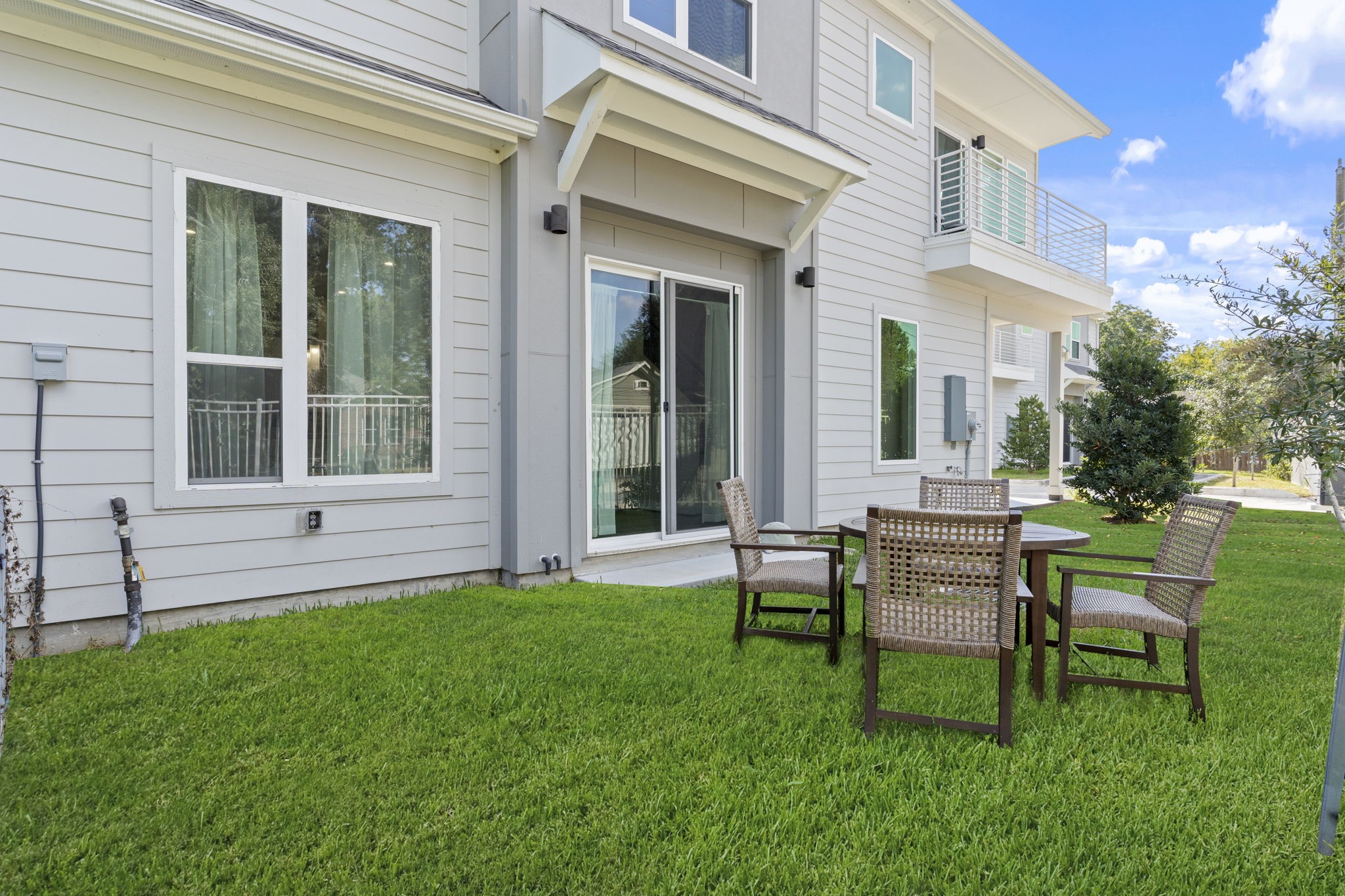 851 Prosper Street Houston, TX 77088 - Photo 47 of 50 a view of a house with a backyard and sitting area