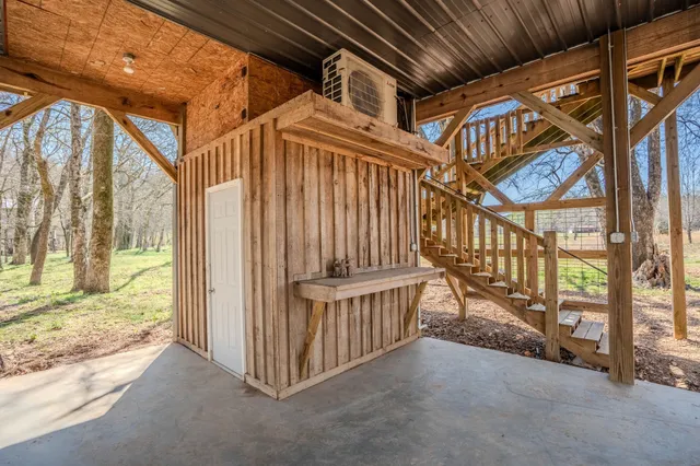 a view of a house with a yard covered with snow