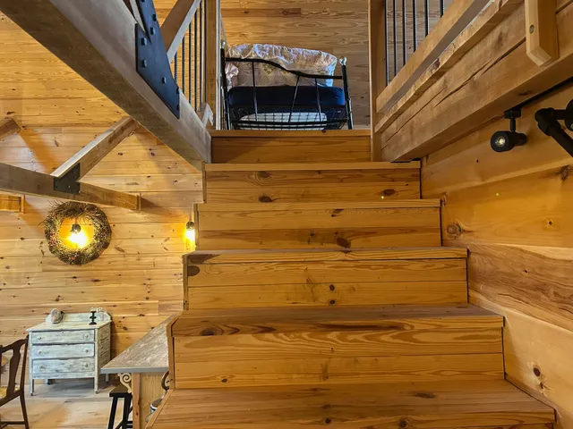 a bedroom with a bed and a table