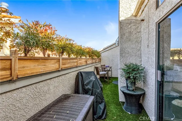a view of a balcony with wooden floor