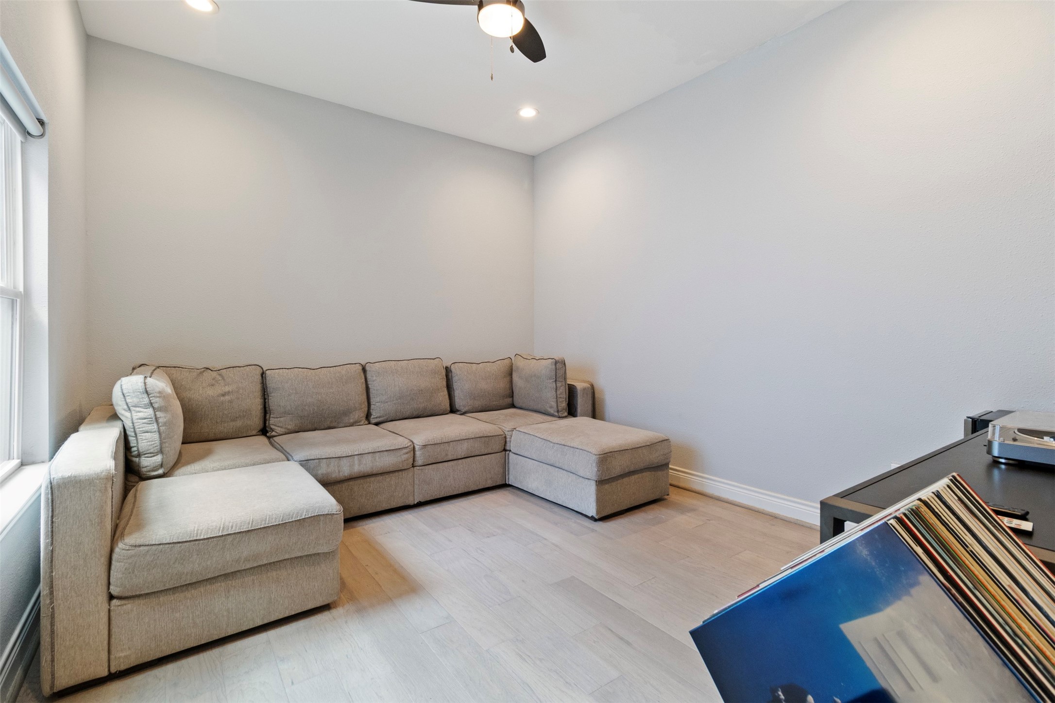 6706 Lozier Street Houston, TX 77021 - Photo 26 of 32 a living room with furniture and a wooden floor