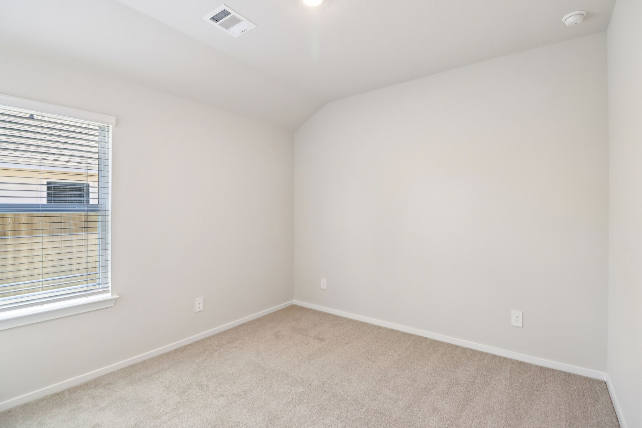 16273 Parish Pointe Court Conroe, TX 77302 - Photo 19 of 29 a view of an empty room and a window