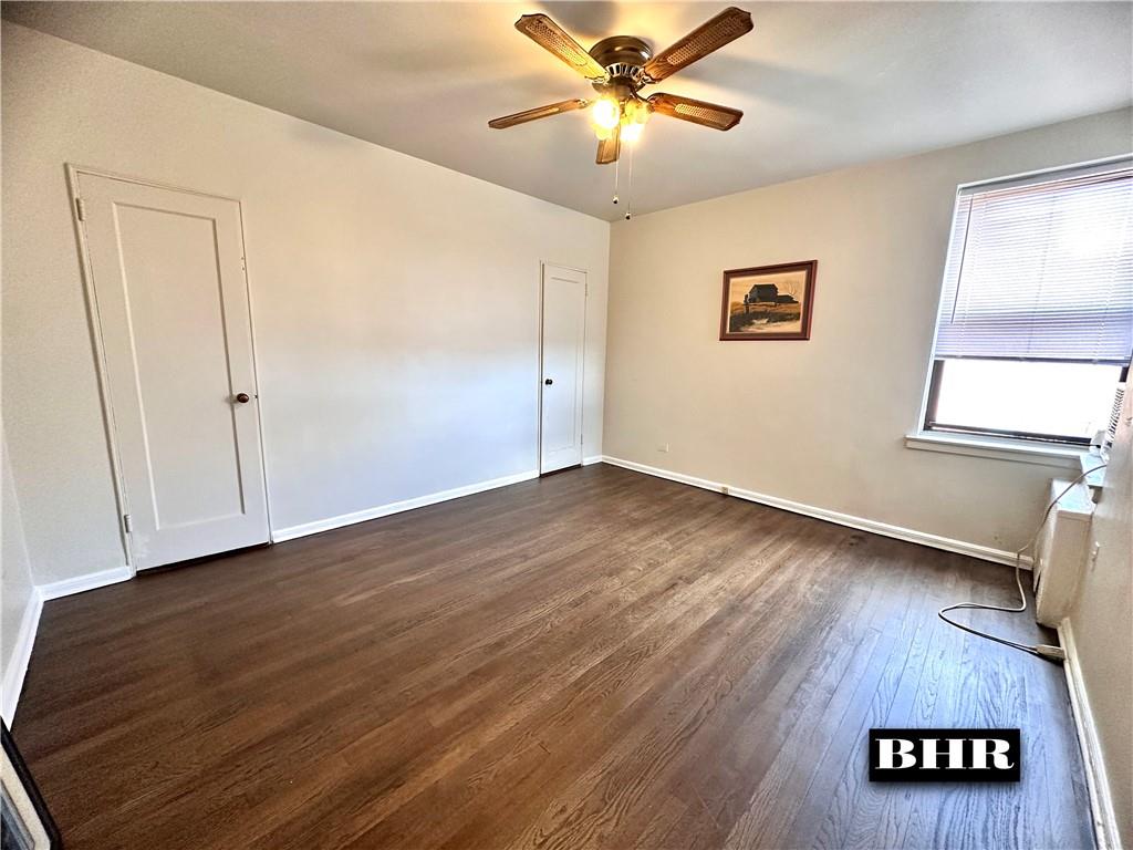 2615 Homecrest Avenue, Unit 6B Brooklyn, NY 11235 - Photo 9 of 17 a view of an empty room with wooden floor and a window
