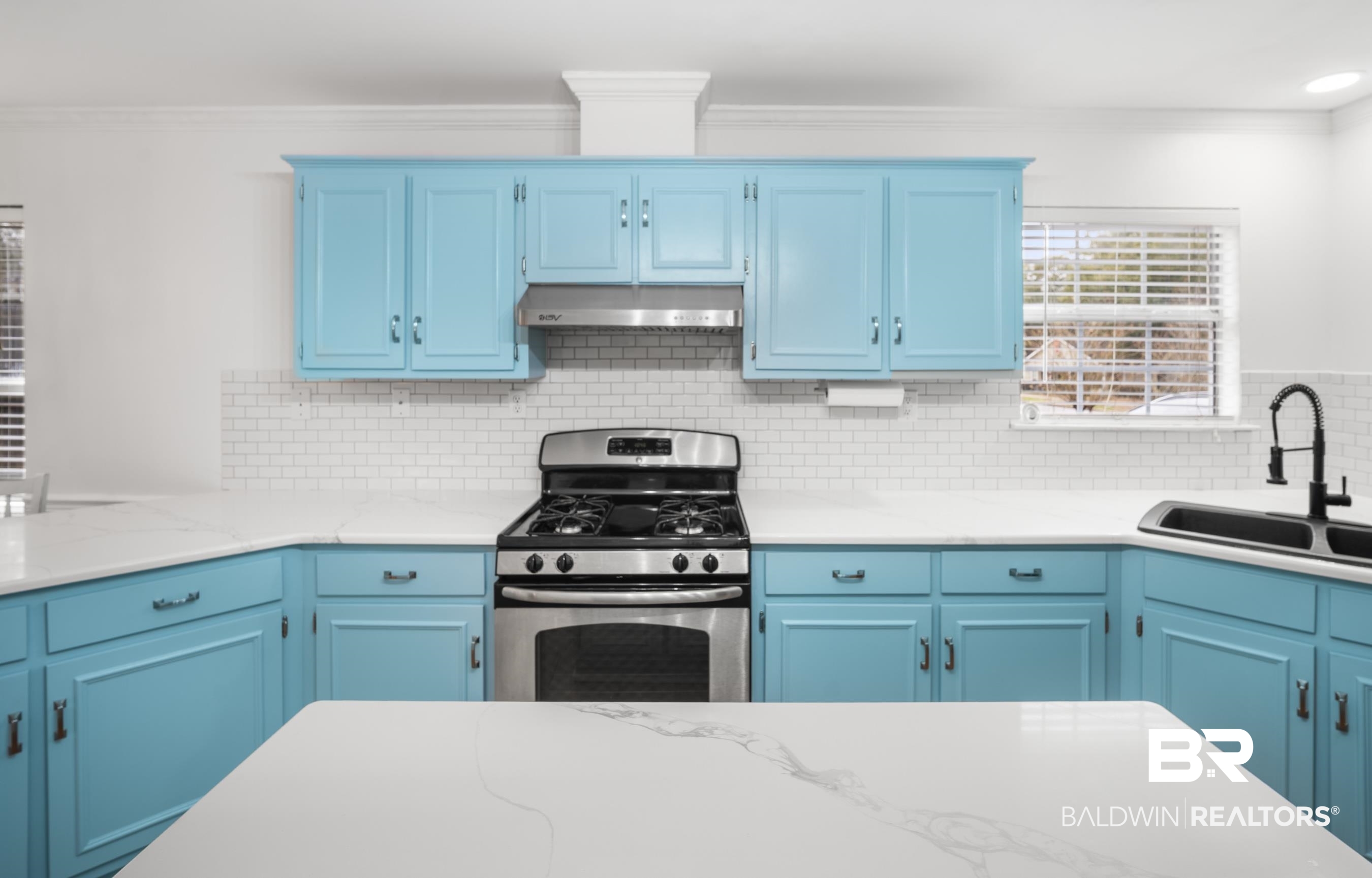 3101 Autumn Ridge Drive West Mobile, AL 36695 - Photo 8 of 36 Kitchen featuring stainless steel range with gas stovetop, blue cabinets, extractor fan, decorative backsplash, and crown molding