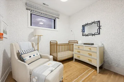 a bedroom with furniture and wooden floor