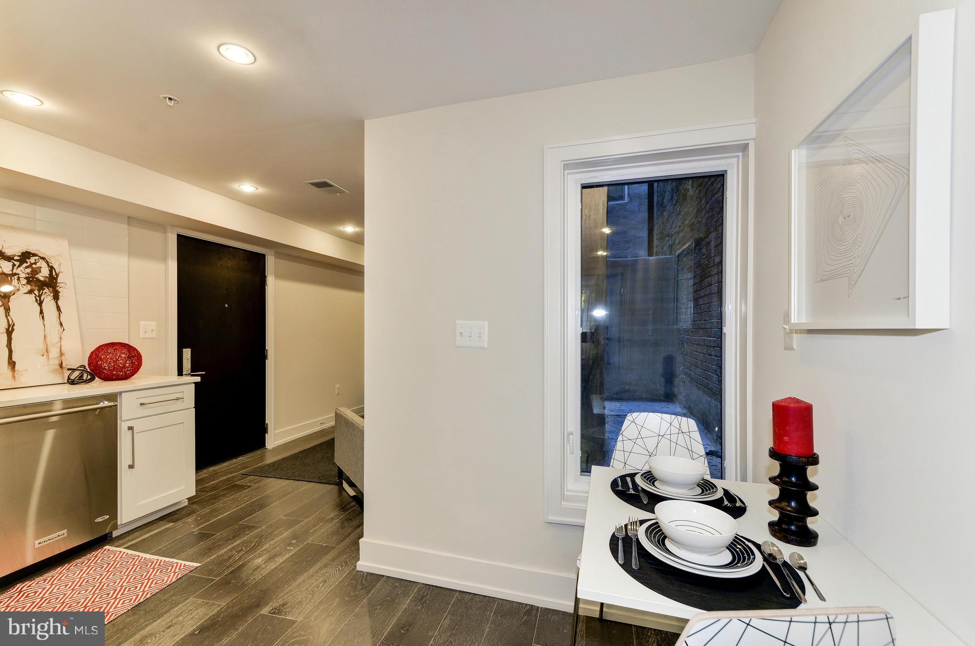 2515 17th Street Northwest, Unit 1 Washington, DC 20009 - Photo 3 of 12 a room with furniture and wooden floor