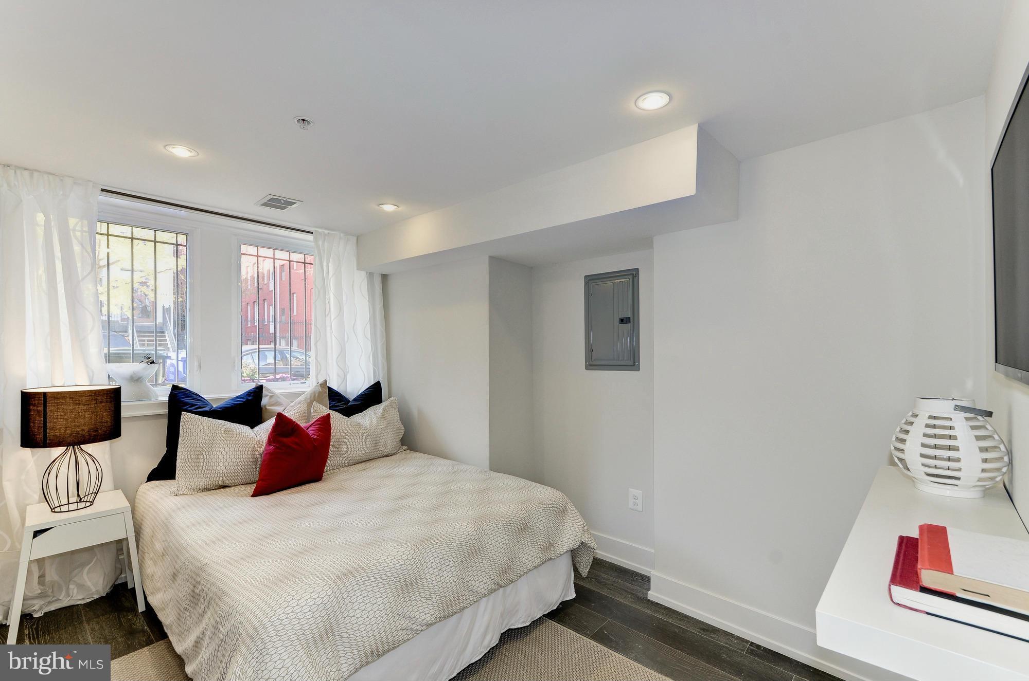 2515 17th Street Northwest, Unit 1 Washington, DC 20009 - Photo 6 of 12 a bedroom with a bed and a window