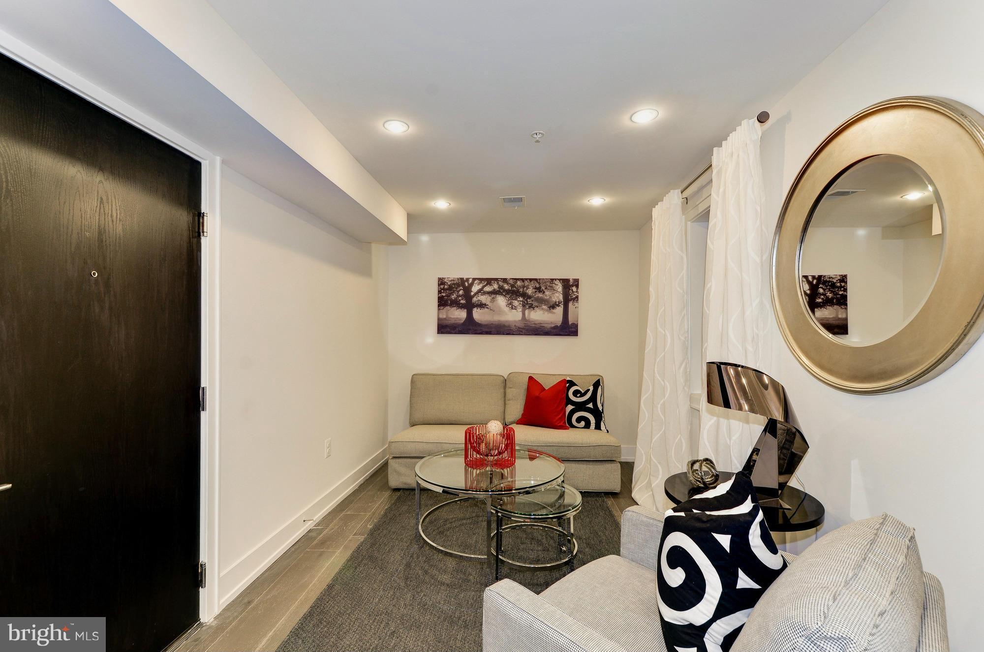 2515 17th Street Northwest, Unit 1 Washington, DC 20009 - Photo 7 of 12 a very nice looking room with a mirror and a wooden floor