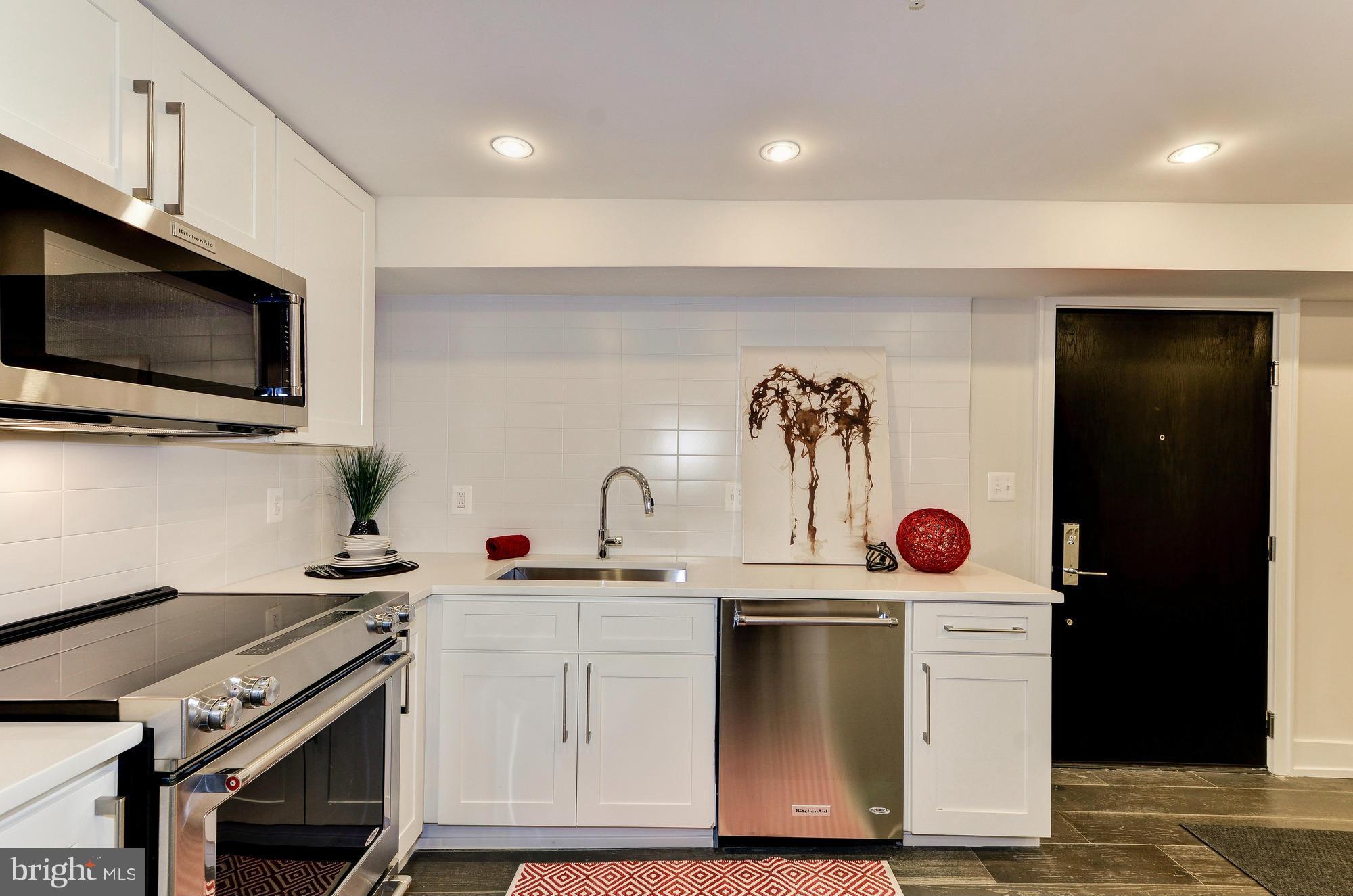 2515 17th Street Northwest, Unit 1 Washington, DC 20009 - Photo 10 of 12 a view of a kitchen with a stove and a sink