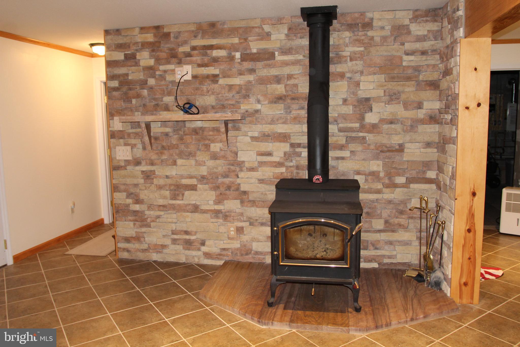 417 Greenwood Ridge Road Accident, MD 21520 - Photo 59 of 91 Brick Wall, Wood Stove