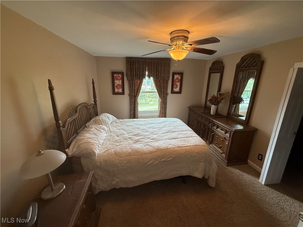 2614 Eldersville Road Follansbee, WV 26037 - Photo 14 of 18 Carpeted bedroom featuring a ceiling fan and baseboards