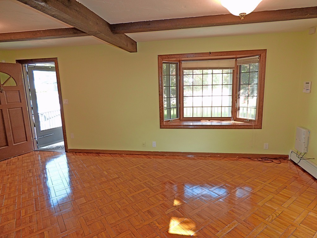 327 Union Street Randolph, MA 02368 - Photo 15 of 29 a view of a room with wooden floor and a window
