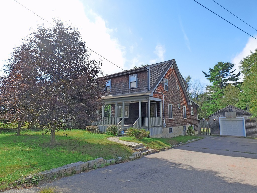 327 Union Street Randolph, MA 02368 - Photo 2 of 29 a front view of house with yard and green space
