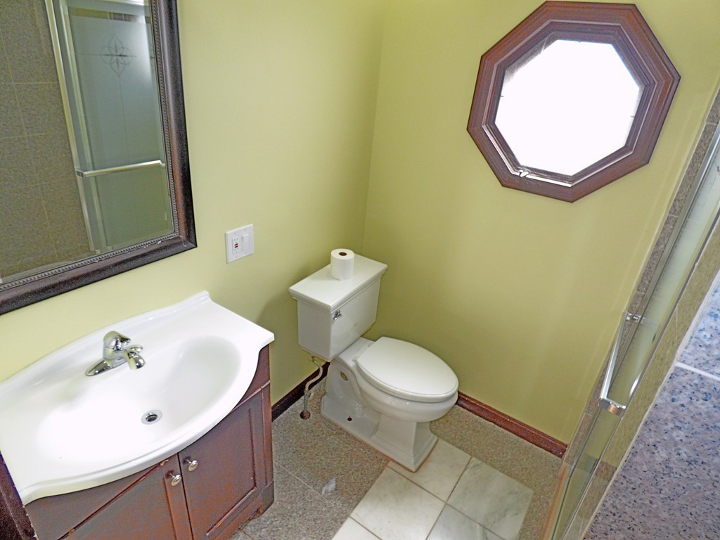 327 Union Street Randolph, MA 02368 - Photo 21 of 29 a bathroom with a toilet sink and mirror