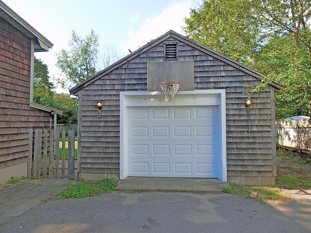 327 Union Street Randolph, MA 02368 - Photo 5 of 29 a front view of a house with a yard