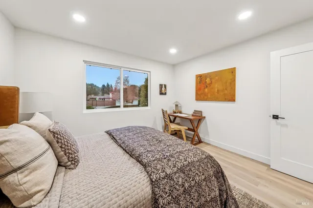 a bedroom with a bed and a table in it