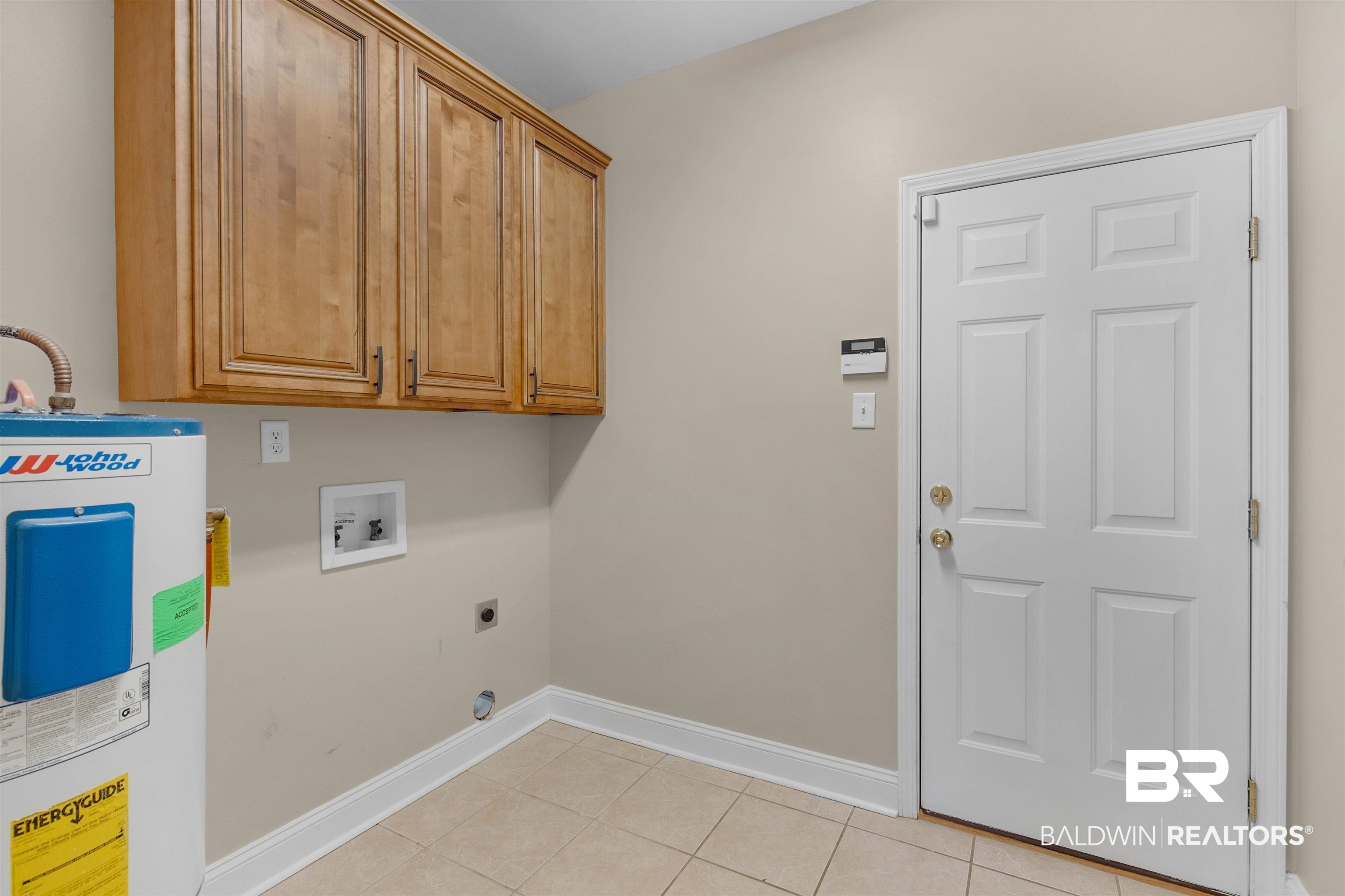 330 Allison Court Mobile, AL 36608 - Photo 19 of 27 Clothes washing area featuring light tile patterned flooring, cabinets, electric dryer hookup, washer hookup, and water heater