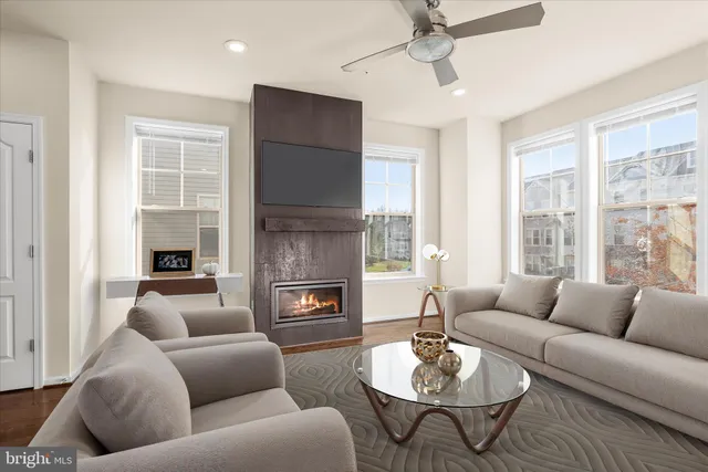a view of a dining room with a table and chairs
