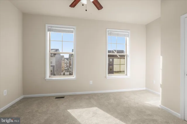 a bathroom with a sink toilet and a mirror