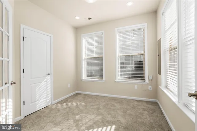 a picture of a bench in front of a wall