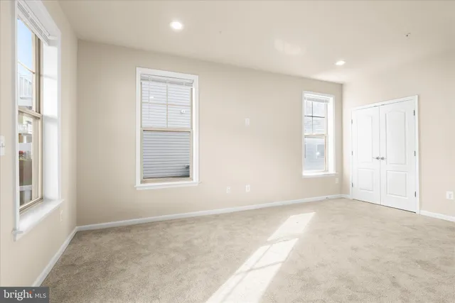 a wooden sign that is on a brick wall