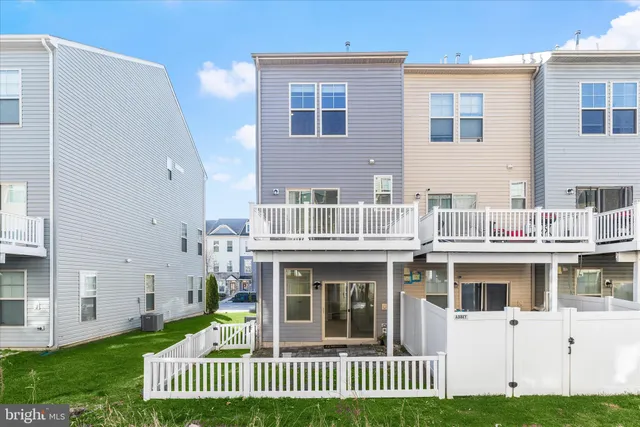 a view of a swimming pool with an outdoor seating
