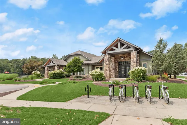 a view of a deck with couches and wooden fence