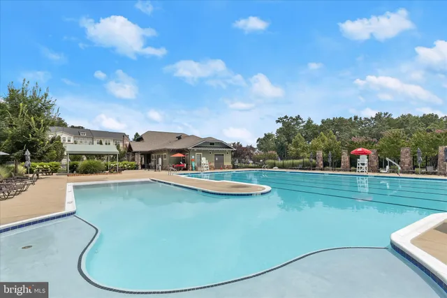 a view of a lake with houses in the background