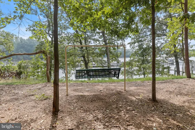 a view of a lake with boats and trees in the background
